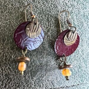 Dangle layered earrings.